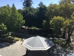 Trees and a bandstand in a Porto garden, from the hostel's website